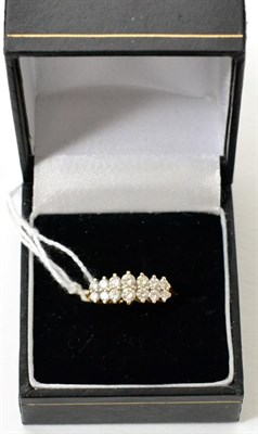 Lot 409 - A diamond double row ring