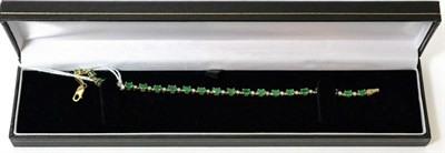 Lot 413 - A 9ct gold emerald and diamond bracelet