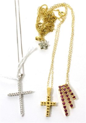 Lot 414 - A diamond cross pendant, a diamond cluster pendant and two 9ct gold gem set pendants