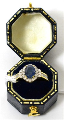 Lot 422 - An 18ct gold sapphire and diamond ring