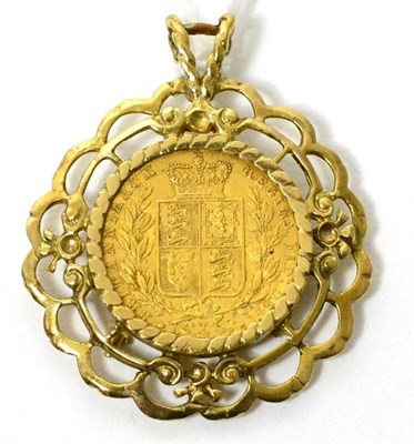 Lot 424 - A Victorian 1869 sovereign in a 9ct gold frame