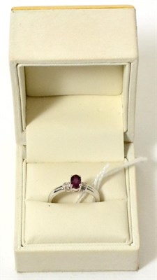 Lot 451 - A 9ct white gold rubelite and diamond ring, finger size N1/2