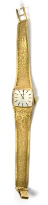 Lot 457 - A 9ct gold Lady's Tissot wristwatch with integral 9ct gold strap