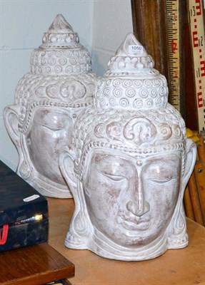 Lot 1050 - A pair of terracotta Buddha heads