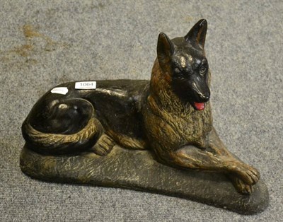 Lot 1064 - A composition model of a seated German Shepherd