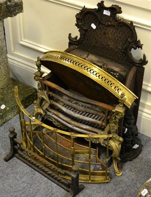 Lot 1065 - A cast iron fire grate together with a cast iron punch door stop