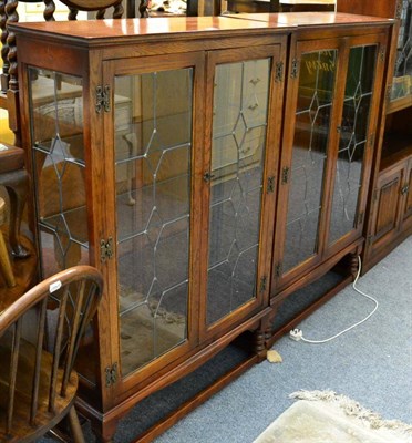 Lot 1080 - A pair of oak and leaded glass bookcases