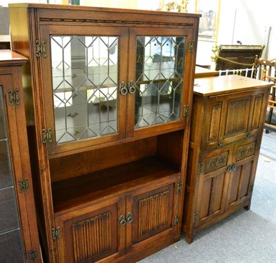 Lot 1081 - An oak leaded glass bookcase cabinet together with a similar cocktail cabinet (2)