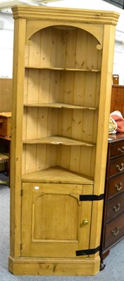 Lot 1091 - A modern pine standing corner cupboard