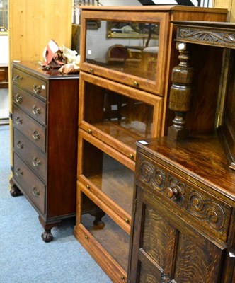 Lot 1092 - A reproduction mahogany five height chest of drawers and a bookcase