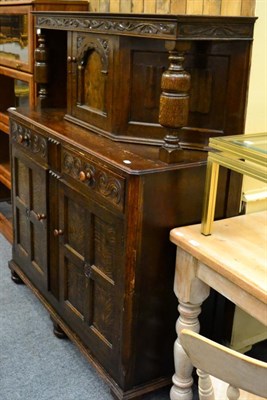 Lot 1093 - A reproduction oak court cupboard