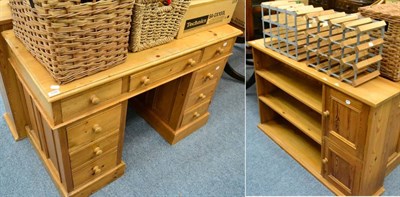 Lot 1096 - A pedestal desk together with a pair of pine low bookcase cabinets