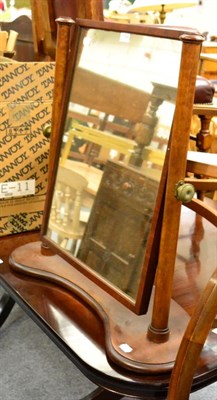 Lot 1098 - A single mahogany arched bed frame and a dressing table mirror (2)