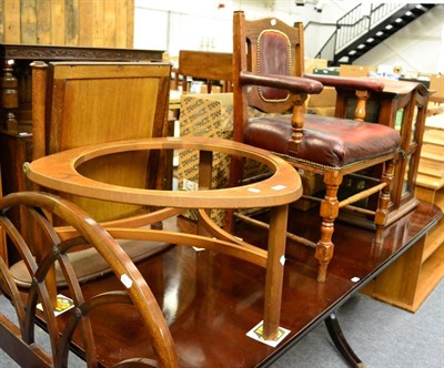 Lot 1101 - An oak and studded leather open armchair, a glazed cabinet and a coffee table (lacking glass) (3)