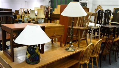 Lot 1102 - A pine pedestal desk, a pine kitchen table and four chairs, a bedside cupboard, two further bedroom