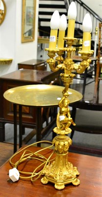 Lot 1107 - A gilt bronze five light table lamp decorated with scrolls, leaves and putto