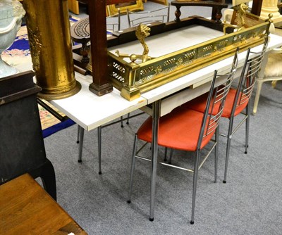 Lot 1110 - A 1950's melamine topped chrome kitchen table and four matching chairs