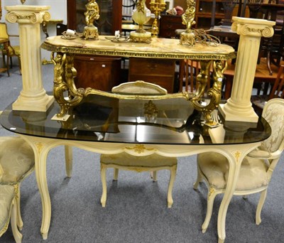 Lot 1112 - A modern glass topped dining table in the French taste, a gilt metal marble topped coffee table and