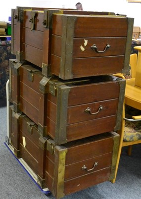 Lot 1117 - A group of three matching camphor wood lined brass bound trunks/cargo chests with bolted hinges