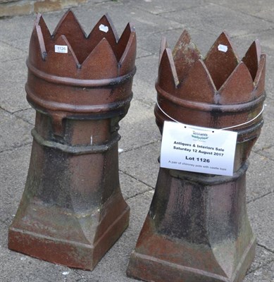 Lot 1126 - A pair of chimney pots with castle tops