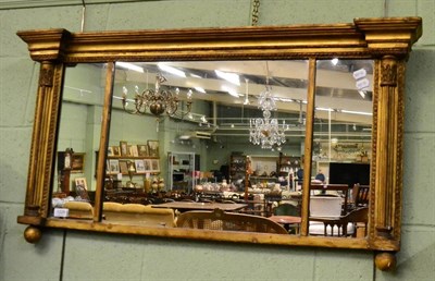 Lot 1228 - A Regency giltwood, inverted breakfront sectional mirror