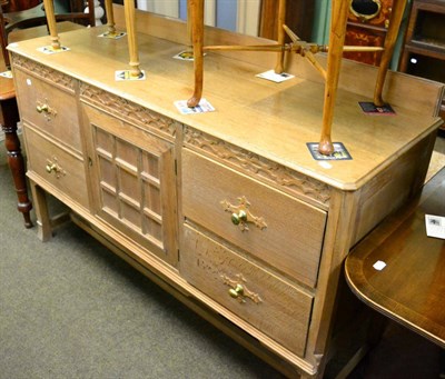 Lot 1242 - A lined oak sideboard