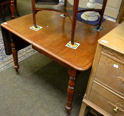 Lot 1243 - A mahogany drop leaf dining table