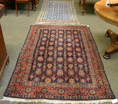 Lot 1244 - A Senneh rug, Iranian Kurdistan, the indigo field of polychrome flowers heads enclosed by...