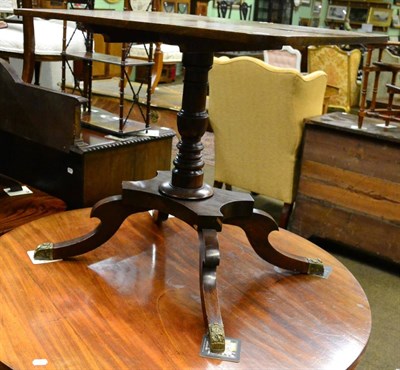 Lot 1245 - A Regency mahogany flip top table on turned legs