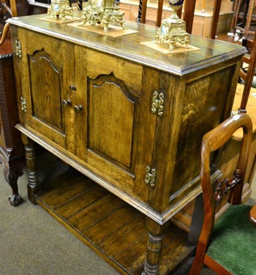 Lot 1253 - An oak livery cupboard