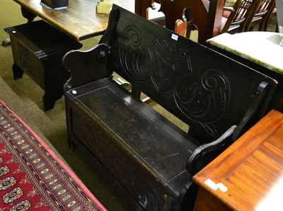 Lot 1272 - A carved oak settle and box stool