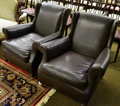 Lot 1275 - A pair of Victorian armchairs recovered in brown leatherette