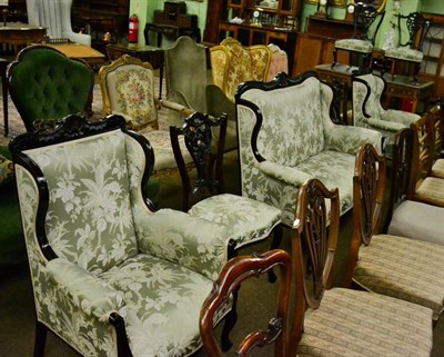 Lot 1283 - An early 20th century mahogany salon suite, including two canape and various chairs (9)