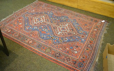 Lot 1292 - A Kamseh rug, South West Iran the mid-indigo field of tribal devices around two diamond...