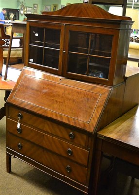 Lot 1323 - A mahogany bureau with glazed superstructure