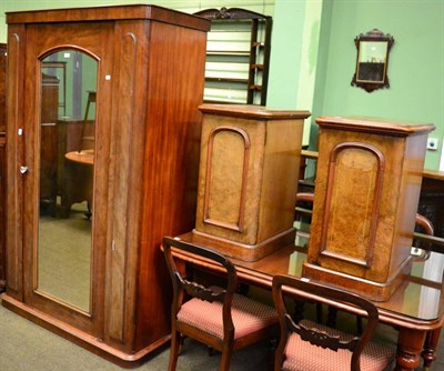 Lot 1329 - A Victorian mahogany mirror fronted wardrobe together with a pair of walnut bedside cupboards...