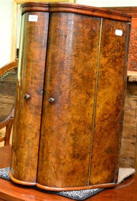 Lot 1330 - A walnut corner cupboard