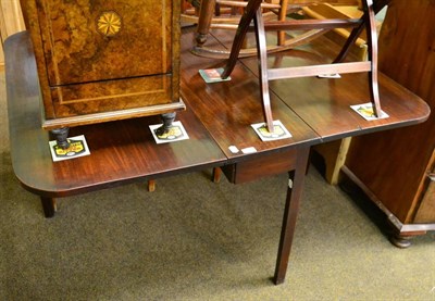 Lot 1333 - A George III mahogany dining table