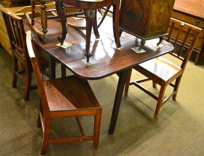 Lot 1336 - A set of three oak dining chairs with plank seats&nbsp