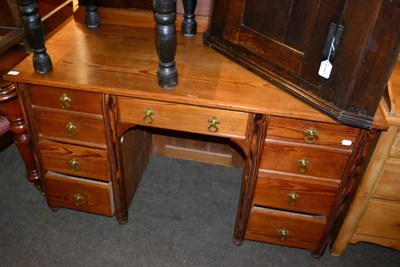 Lot 1339 - A pitch pine nine drawer kneehole desk, with makers stamp Appleyard & Sons of Rotherham