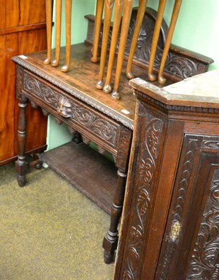 Lot 1344 - A Victorian carved oak side table