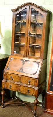 Lot 1356 - An oak 1920's/30's bureau bookcase