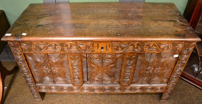 Lot 1360 - A carved oak coffer with initials J.R to the front