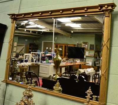 Lot 1372 - A Regency giltwood inverted breakfront over mantel mirror, the bevelled rectangular plate...