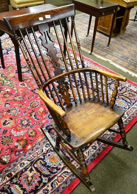 Lot 1384 - An elm Windsor rocking chair (rocker replaced)