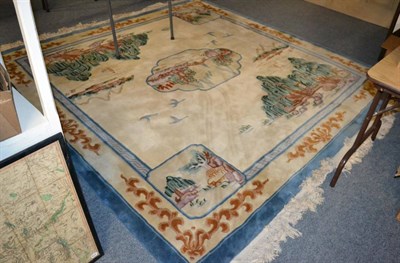 Lot 1388 - A 20th century Chinese wool carpet of unusual size,  the ivory field of Willow pattern design...