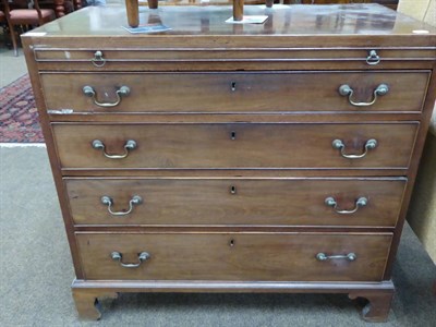 Lot 1392 - A Georgian chest of drawers with brushing slide