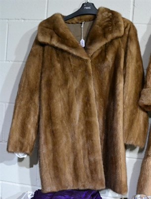 Lot 1402 - A light brown mink coat, the lining embroidered with initials ' J.O.L'