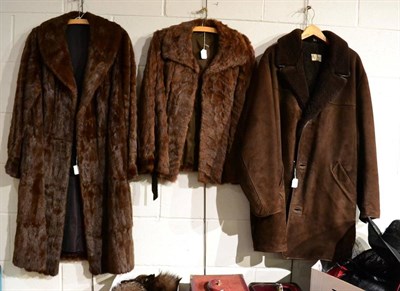 Lot 1403 - A dark brown mink long fur coat, a brown short mink jacket, a Day Dean, Brighton brown sheep...