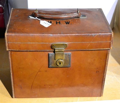 Lot 1414 - A vintage Finnigans leather top hat box, embossed with initials R.H.W, 35cm by 21cm, 28cm high,...